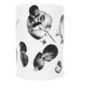 Zuko Gumleaf black and white mug. Perfect for outdoor gatherings or elegant indoor settings, the vibrant gum leaf design on a classic cup adds a touch of nature to any table. ( front view)