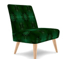 Emerald Green occasional chair. Its bold green forest hue and striking pattern add a playful yet sophisticated touch to any room, exuding opulence and charm.Sideview.