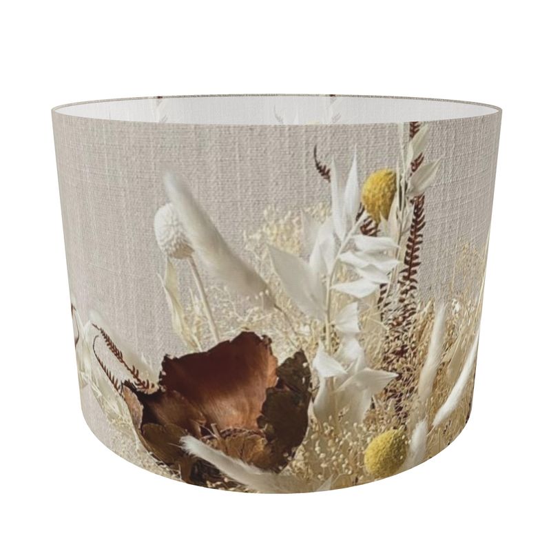 The Maggie Protea lampshade. The striking blend of earthy browns, soft beiges, and sunny yellows captures both sophistication and charm. Adorn your space with this exquisite lampshade that is truly a masterpiece.