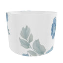 Hibiscus Blue lampshade features a classic white drum shape adorned with a delicate blue hibiscus pattern. Back.