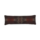 A long rectangular lumbar pillow in dark brown velvet with an ornate beige pattern in the center and on the sides, shown against a plain white background.