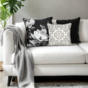 Black and grey magnolia velvet cushion styled with the ivory and black velvet cushion.