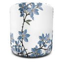 Stunning blue jasmine on white round ottoman side.