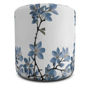 Stunning blue jasmine on white round ottoman.