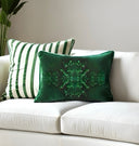 Emerald Green velvet cushion and a green and white striped cushion combo. Beautifully Styled on a white sofa. 