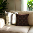Enoch Brown cushion styled with the brown and white stripped cushion.