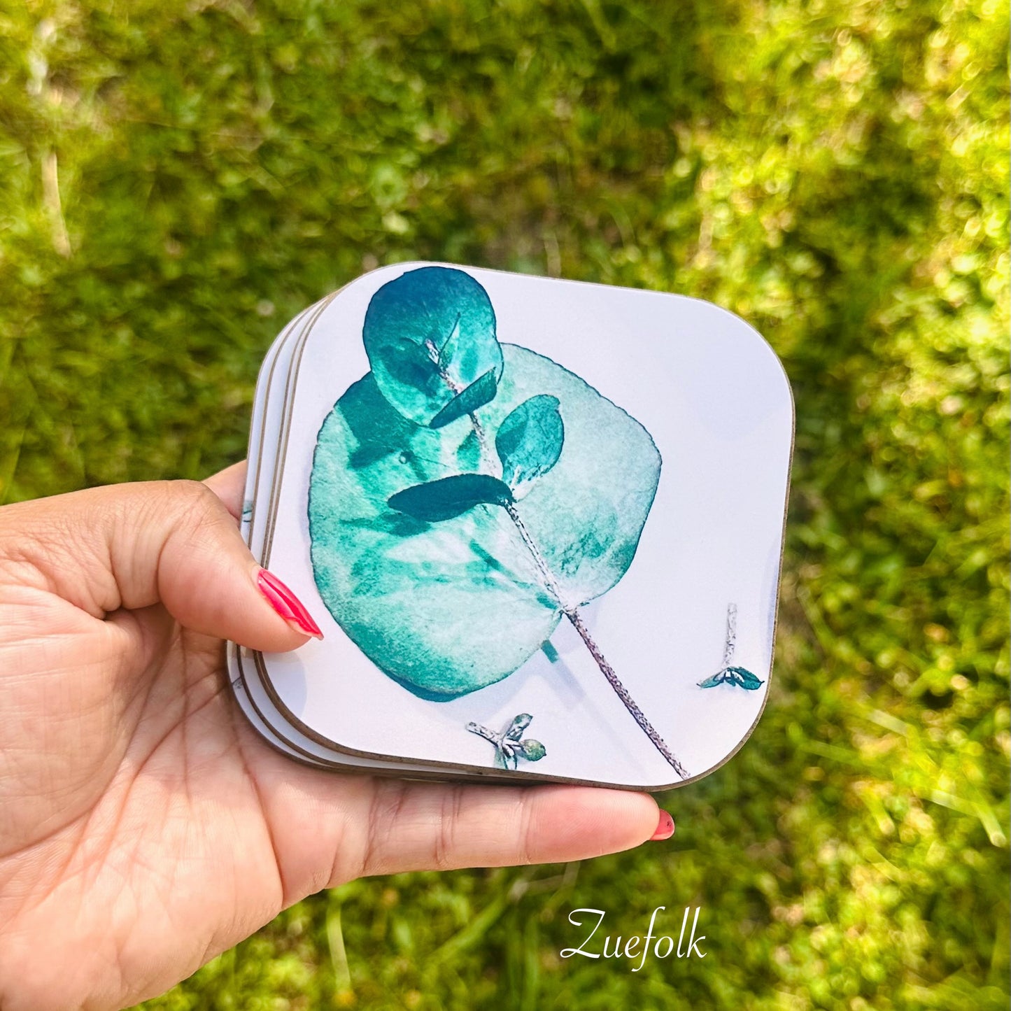 Eucalyptus Green and white Coasters  are Hand made 
Heat resistant, durable
Super sharp beautiful high quality permanent print
Glossy surface with hard wooden base which will protect the surface of your furniture 
Easy to care for and maintain