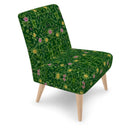 Green Forest occasional chair. The playful yet sophisticated design features a bold green forest colour with contrasting pink and yellow floral pattern. Sideview