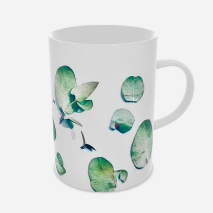 Eucalyptus Green Coffee Mug Set. Perfect for outdoor gatherings or elegant indoor settings, the vibrant gum leaf design on a classic cup adds a touch of nature to any table. ( side view)