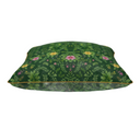 Green leafy patterned cushion with pink and yellow florals with a yellow piping on a green background. 
