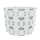 Green and white patterned drum lampshade.