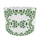 White drum lampshade with green leaf pattern on a white background