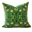 Green leafy patterned cushion with floral pattern on green  background.
