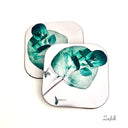 Eucalyptus Green and white Coasters  are Hand made 
Heat resistant, durable
Super sharp beautiful high quality permanent print
Glossy surface with hard wooden base which will protect the surface of your furniture 
Easy to care for and maintain