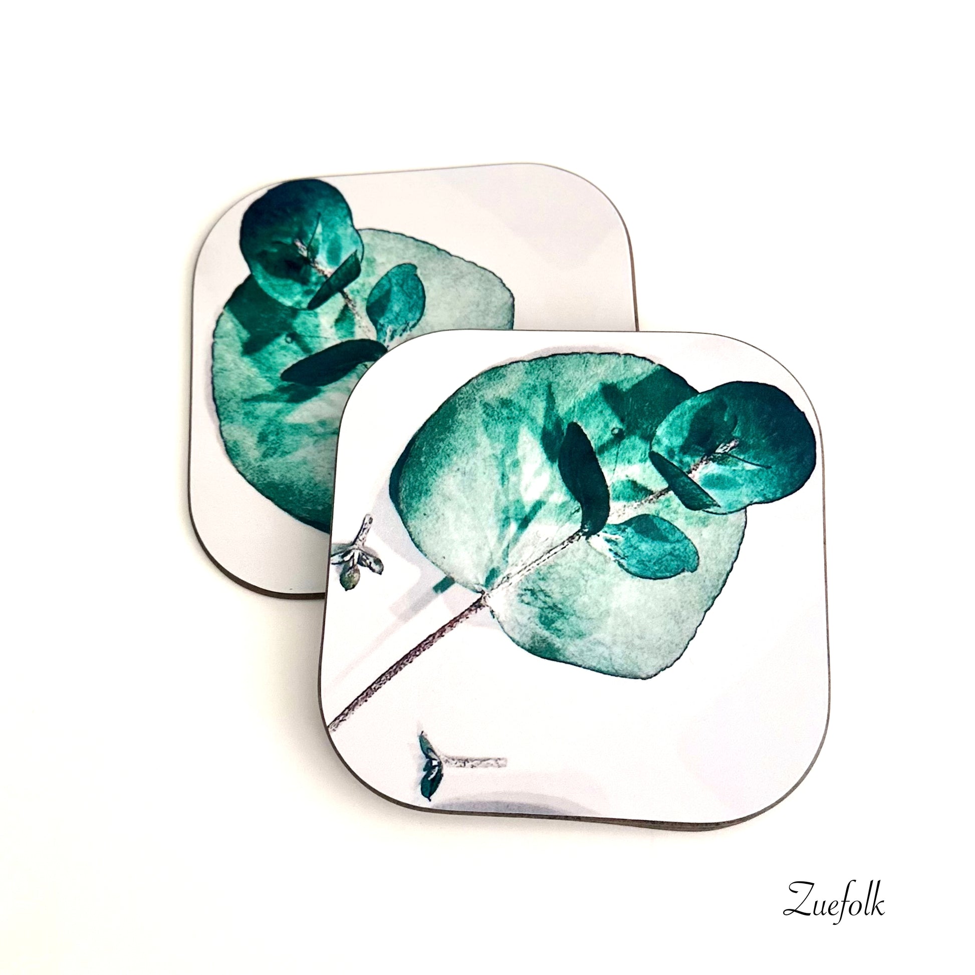 Eucalyptus Green and white Coasters  are Hand made 
Heat resistant, durable
Super sharp beautiful high quality permanent print
Glossy surface with hard wooden base which will protect the surface of your furniture 
Easy to care for and maintain