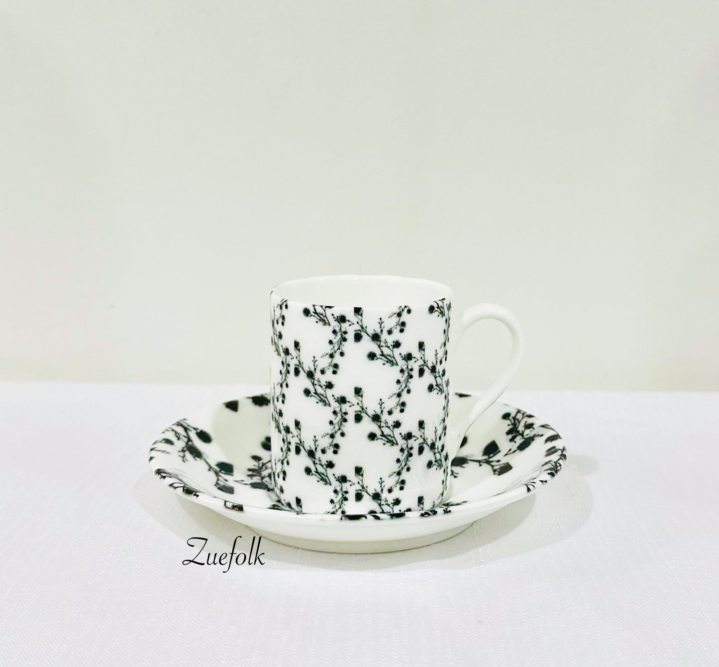 Grounded, peaceful, textured lux is what you will find in this Coffee Cup and Espresso cup and saucer Bone China ensemble. 