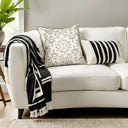 Ivory and black patterned velvet cushion. 