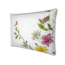 White cotton linen cushion adorned with pink, yellow and white Lilies. Vertical side view.