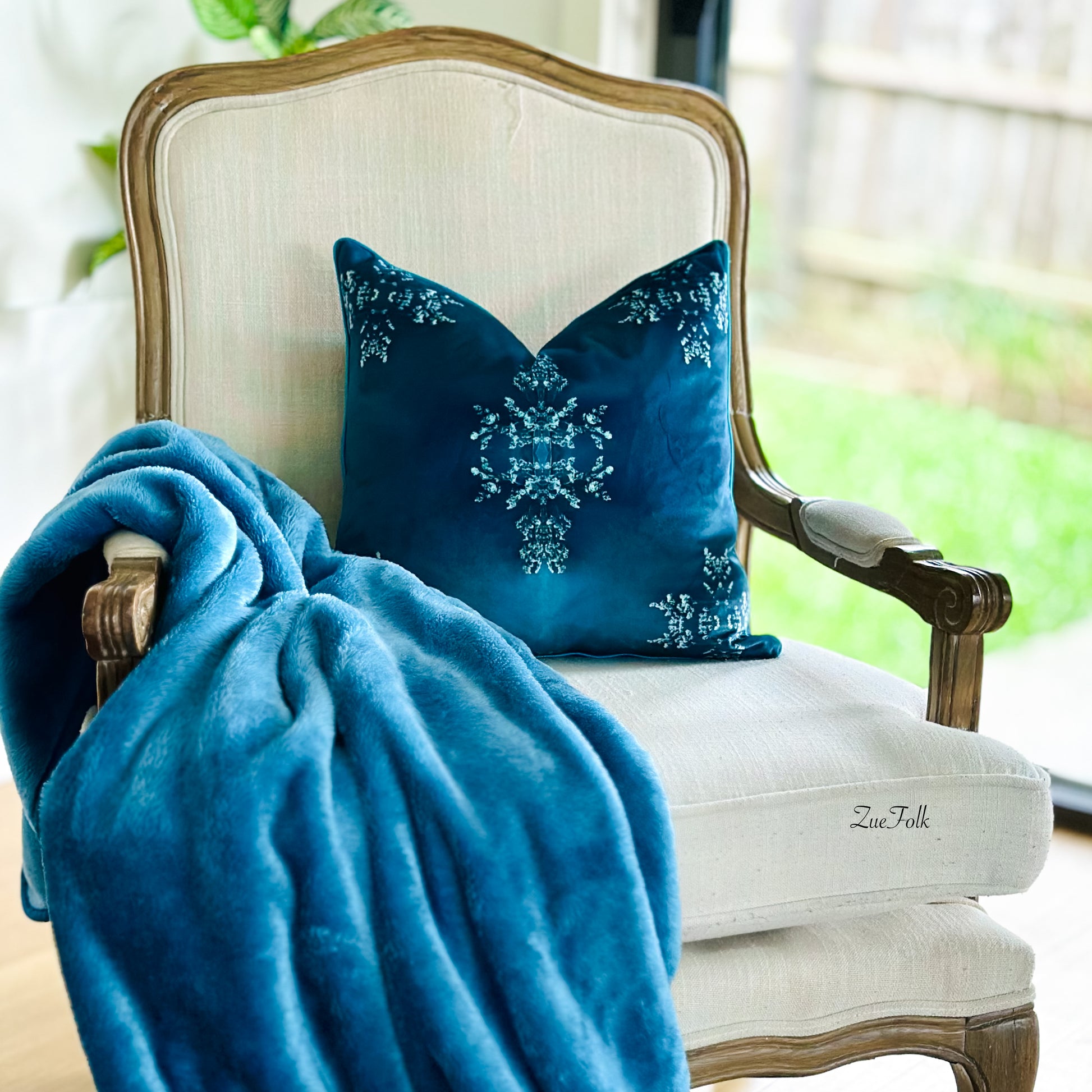 Teal Cushion and cushion cover. lux soft velvet. piped in green. A lovely statement piece for any home decor style.  Styled with a lush velvet throw.