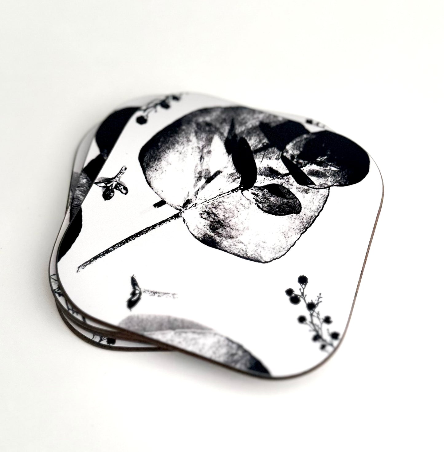 Coasters . Zuko Gumleaf. Black and white Coasters  are Hand made 
Heat resistant, durable
Super sharp beautiful high quality permanent print
Glossy surface with hard wooden base which will protect the surface of your furniture 
Easy to care for and maintain