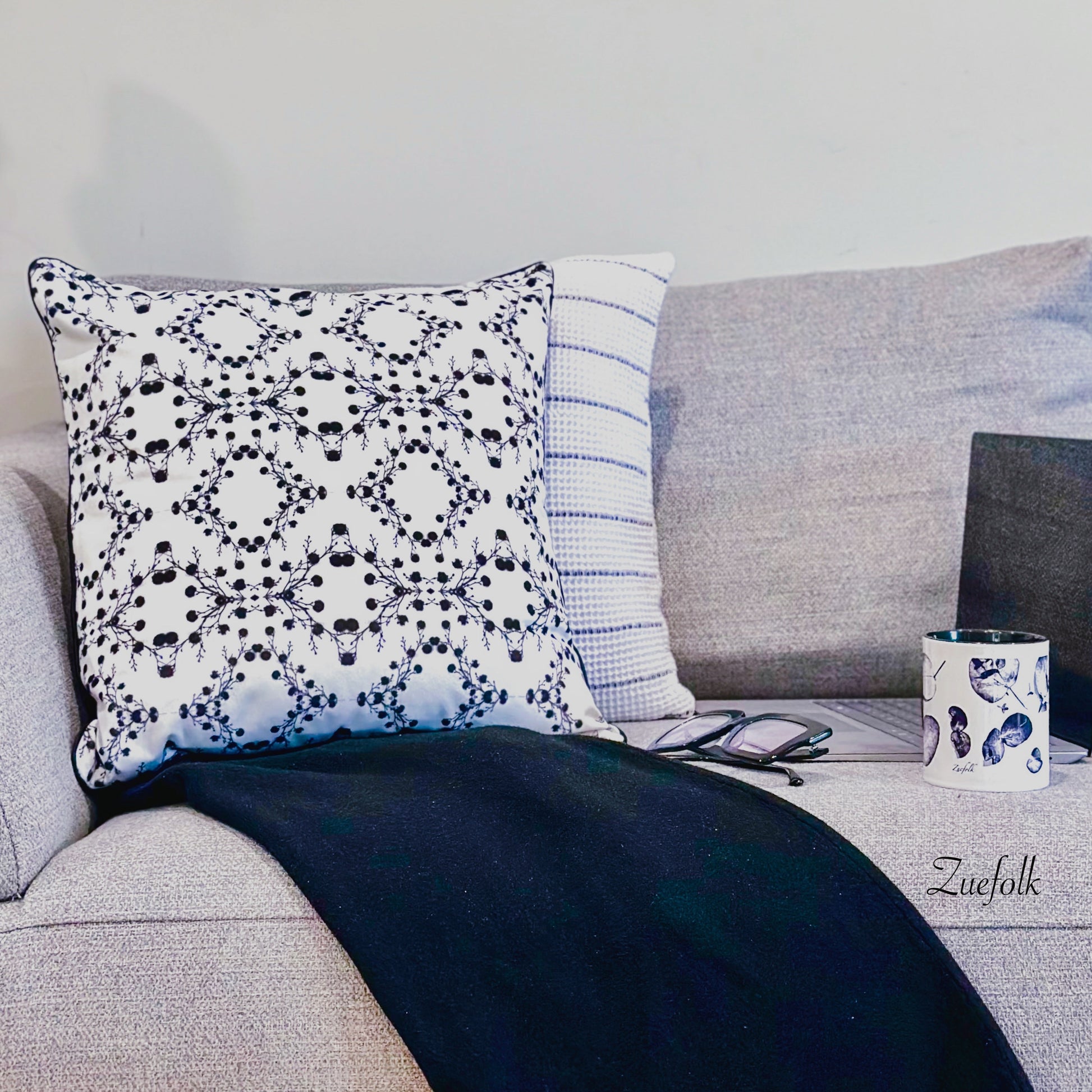 Zuko Black and White Velvet cushion. Stunning, classic, black and white, sophisticated and warm velvet cushion and cushion cover.  styling on grey sofa. 